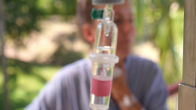 Female Patient with Iv Drip in Hospital Outdoors