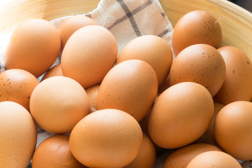 egg in wooden basket with cloth.