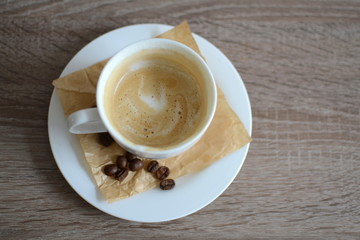 cup of cappuccino on wooden table