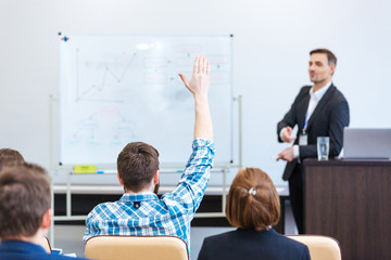Teacher lecturing and tallking to students in univercity