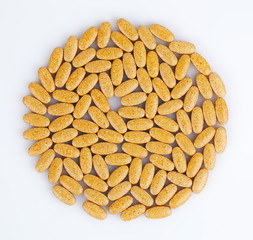 Orange tablets stacked in a circle