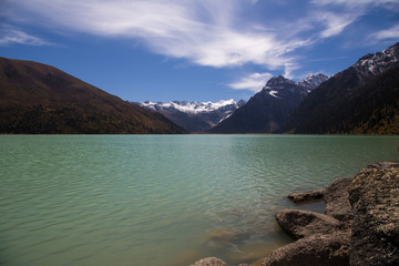 Turquoise Xinluhai lake in Kham region of Tibet, Sichuan, China