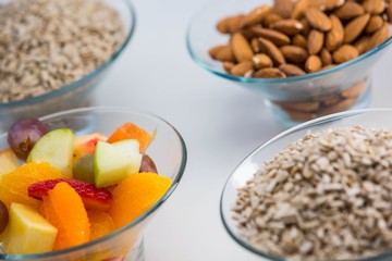 Fruit salad and almond on table