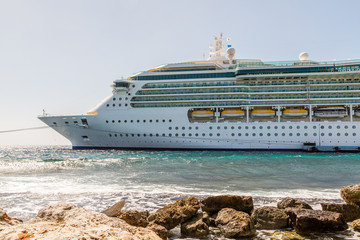 Cruise Ship Moored in Sun by Seawall © dbvirago