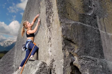 Foto op Aluminium Young athletic girl climber lead climbing and clipping carbines © anatoliy_gleb