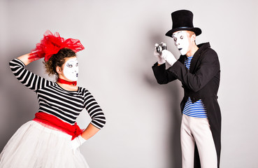 Funny couple of mimes taking a  photo,  April Fools Day