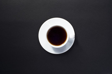 Obraz na płótnie Canvas Cup of coffee on black background.