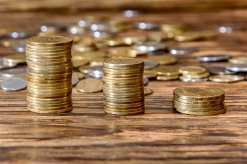 Coins stacked on wood