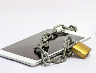 metal chain link locked padlock on tablet omputer and smartphone