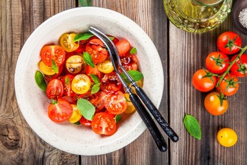 Salad of organic cherry tomatoes with basil, balsamic and olive oil