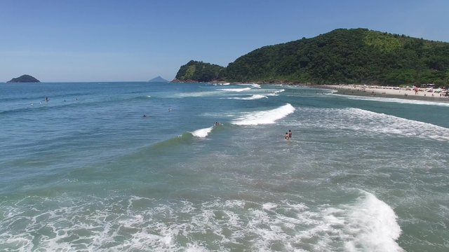 People Surfing and Having Fun in Camburi Beach, Brazil