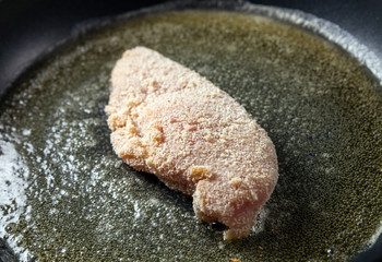 Chicken breast fillets fried in frying pan