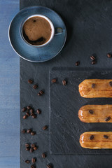 Coffe eclairs with cup of coffee
