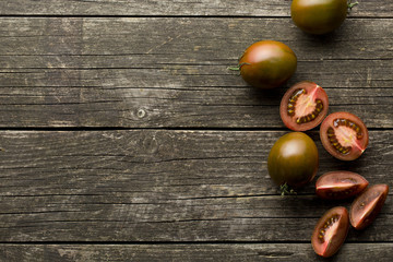 halved dark tomatoes