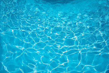 Fototapeta na wymiar Beautiful ripple surface water in swimming pool with sun reflection