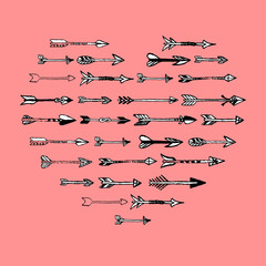 Black  and white hand drawn arrows heart composition on pink bac