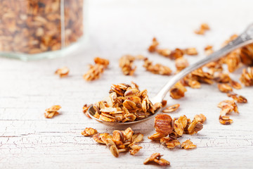 Obraz na płótnie Canvas Healthy breakfast. Fresh granola, muesli in a glass jar Organic oat, almond Copy space