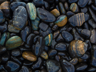 Background of round colored sea pebbles texture