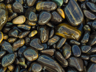 Background of round colored sea pebbles texture