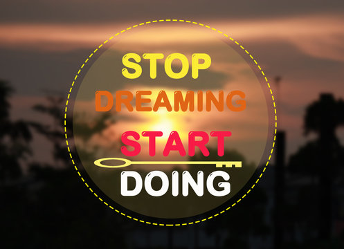 Stop dreaming start doing on sunset background