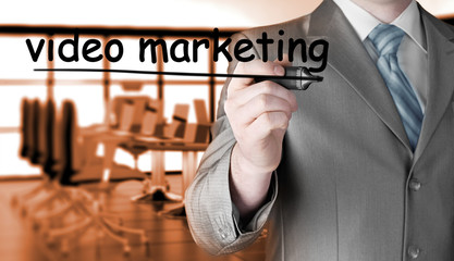 business man writing Video Marketing