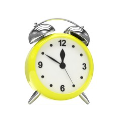 Yellow alarm clock on white