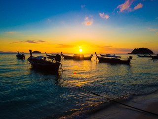 Boat on sea beach sunset