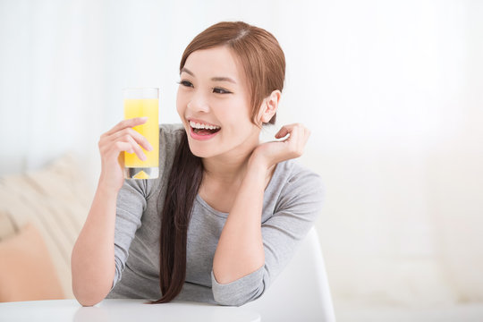 woman hold orange juice