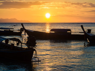 Boat on sea beach sunset