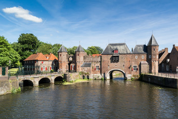 Obraz premium Medieval fortress city wall gate Koppelpoort and Eem River in the city of Amersfoort, Netherlands