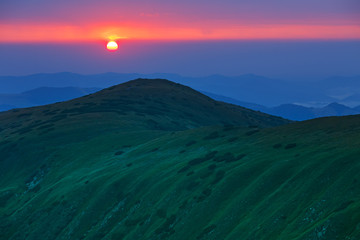Gorgeous vibrant scenic mountain landscape, sunrise in Carpathia