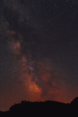 Vibrant night sky, milky way in mountains.