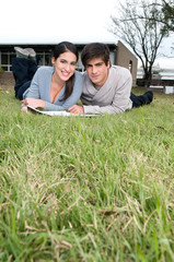 Couple lying on the grass