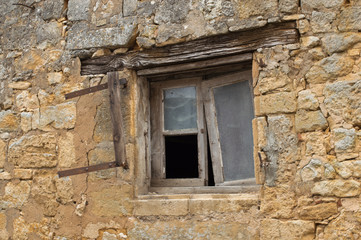 Dilapidated Window in French Stone House