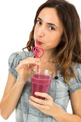 Woman drinking berry smoothie