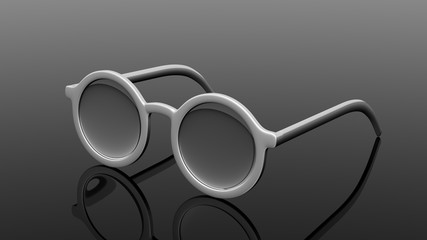 Pair of silver  round-lens eyeglasses, isolated on black background.