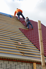 Roofers on the roof