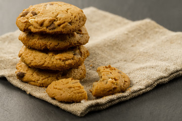 Chocolate chips cookies on black background