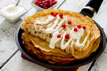 Pancakes on a cast iron skillet in a rustic style, selective foc