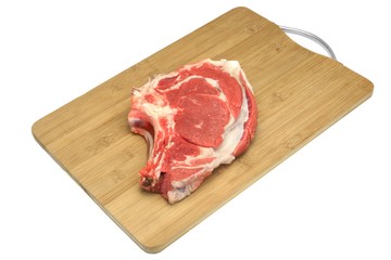 Raw Beef Ribeye Steak On The Wood Cutting Board Isolated