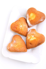 muffins in the form of heart with powdered sugar