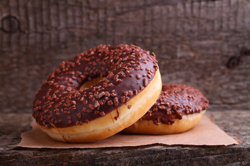 donuts with chocolate on a dark background