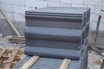 stack of concrete roof tile (gray color) at construction site