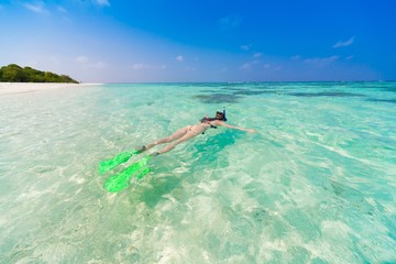 Maldives, women snorkeling