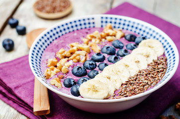 Blueberries healthy smoothies breakfast bowls with nuts, seeds a