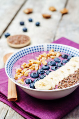 Blueberries healthy smoothies breakfast bowls with nuts, seeds a