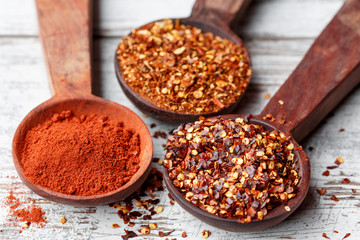 Different types of chilli flakes and paprika
