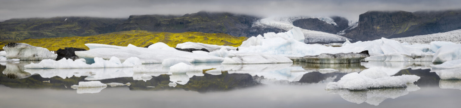 panorama with gray clouds and glacier in ice lagoon in Iceland