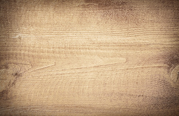 Light brown scratched wooden cutting board. Wood texture