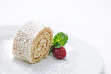 sponge roll cake with cream and fruit decoration on white plate, on-line shop photography, patisserie, sweet dessert